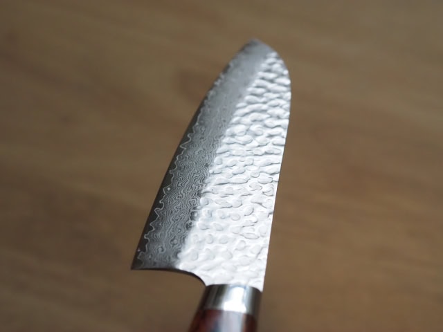 Close-up of a hammered Damascus-pattern Japanese knife blade