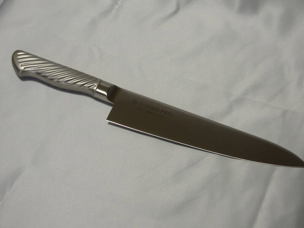 Tojiro Pro gyuto knife blade marked VG10, full length view