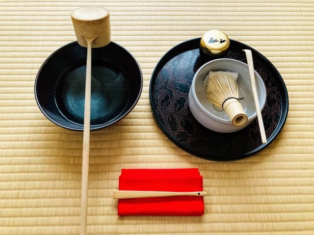 Traditional matcha gift set with chawan, chasen, chashaku, and silk cloth