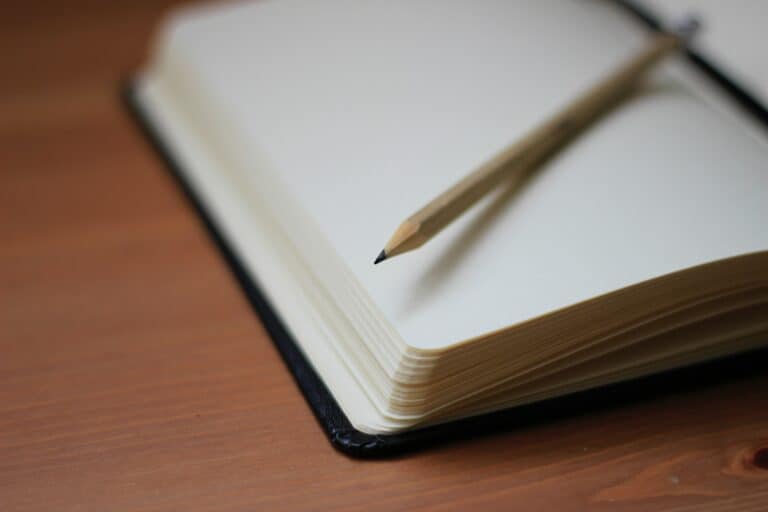 Open notebook and pencil; illustrative journal photograph