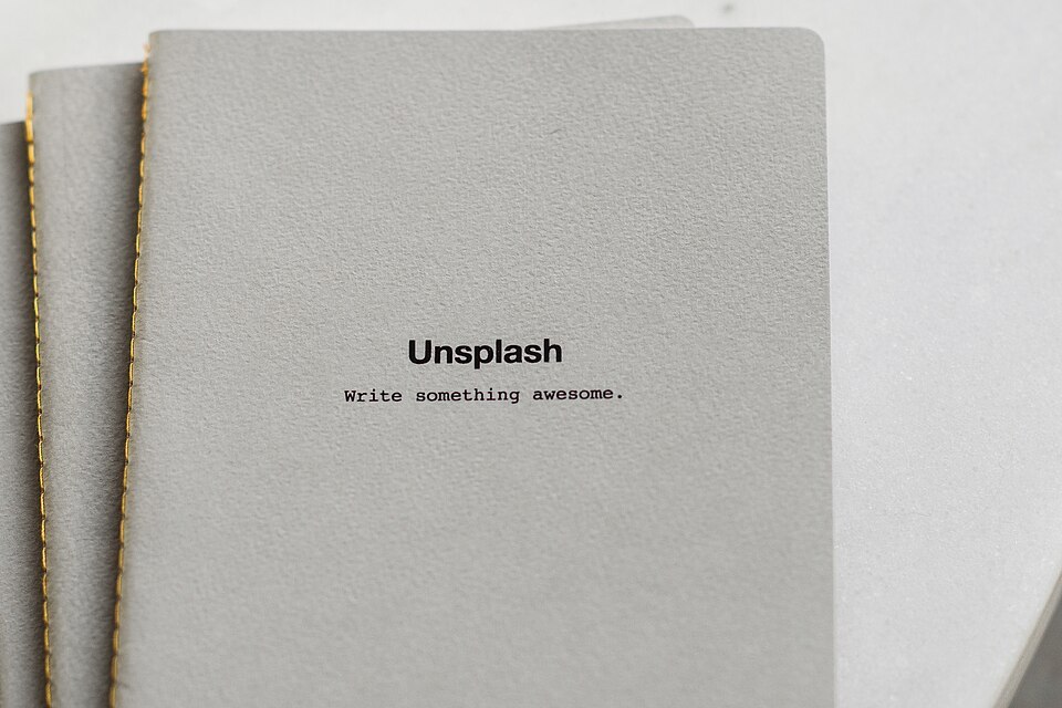 Closed cloth-bound notebook showing its cover and spine