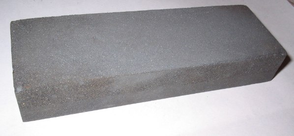 Rectangular oil sharpening stone with two abrasive surfaces